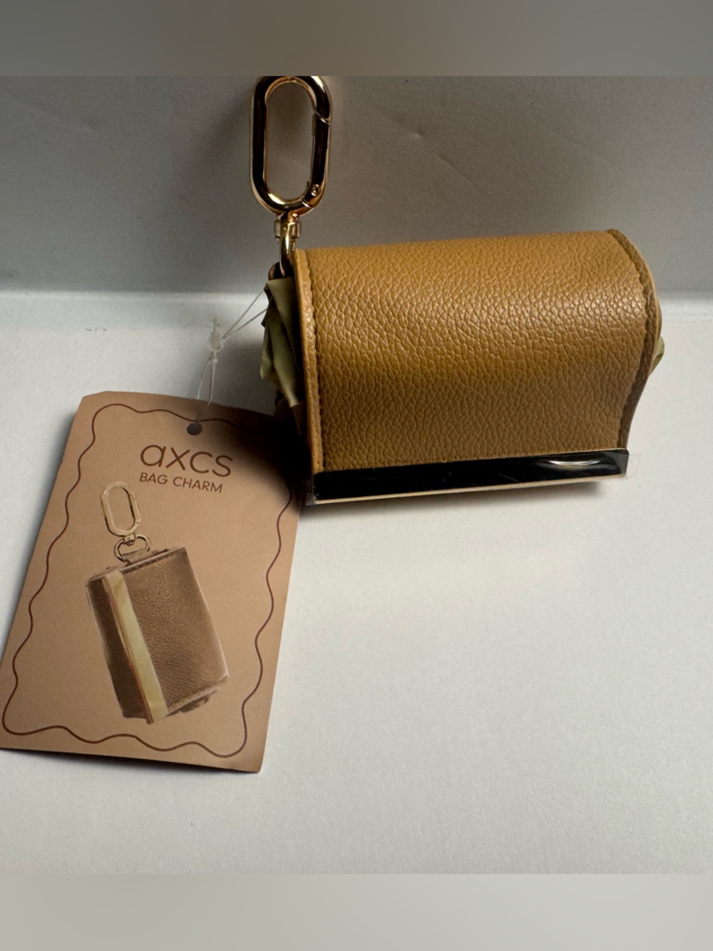 A foldable tote bag charm with carabiner clasp for easy use of reusable bag. - Picture 4 of 7